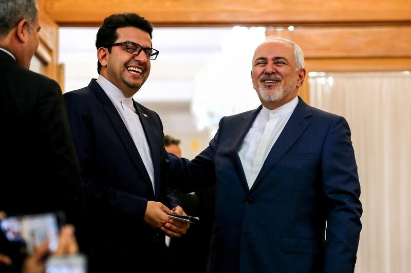 Iran's Foreign Minister Mohammad Javad Zarif (R) speaks with ministry spokesman Abbas Mousavi in the capital Tehran on June 10, 2019.  / AFP / ATTA KENARE
