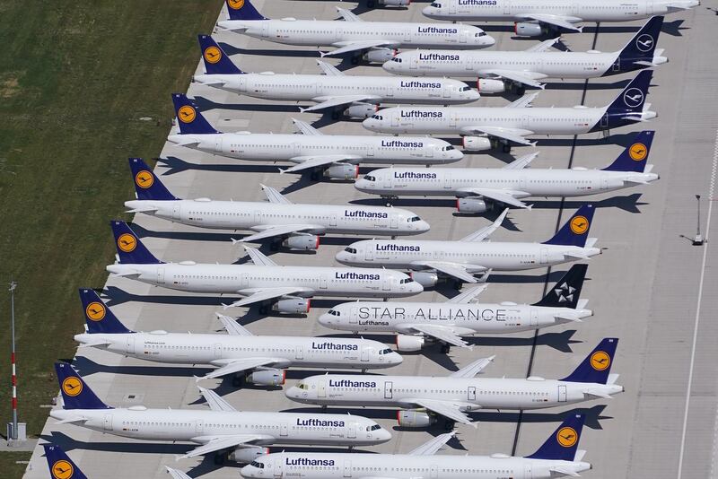 SCHOENEFELD, GERMANY - JUNE 01: Passenger planes of airline Lufthansa that have been temporarily pulled out of service stand parked at Berlin-Brandenburg Airport during the coronavirus crisis on June 01, 2020 in Schoenefeld, Germany. Countries across Europe are easing lockdown measures and many are seeking to promote a return of international travel and tourism. At the same time airlines are still facing a calamitous era, with some already receiving government bailouts and many announcing layoffs.   (Photo by Sean Gallup/Getty Images)