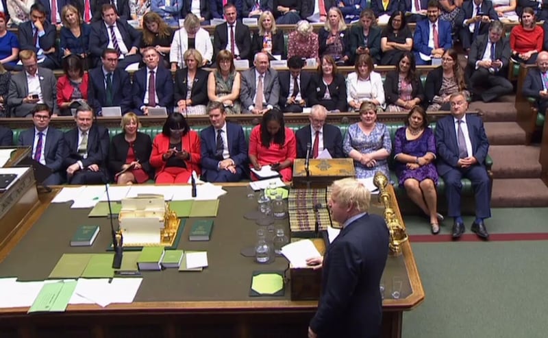 Johnson stands a the dispatch box and speaks in the House of Commons. PRU / AFP