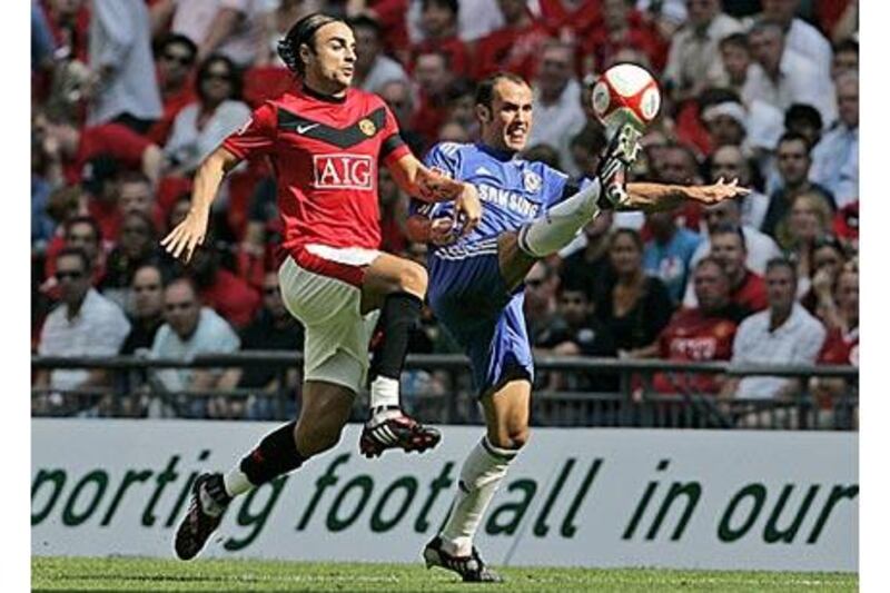 Ricardo Carvalho, right, scorer of Chelsea's first goal, controls the ball under pressure from Manchester United's Bulgarian forward Dimitar Berbatov during the Community Shield at Wembley yesterday.