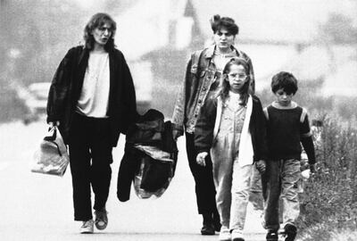 Yugoslavian sisters and their children flee Donji Miholjac in Croatia in 1991 during the war for independence. Laurent Rebours / AP Photo