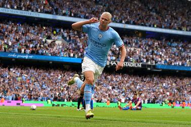 Manchester City's Erling Haaland celebrates scoring his side fourth goal of the game to complete his hat trick during the English Premier League match between Crystal Palace and Manchester City at the Etihad Stadium in Manchester, England, Saturday Aug.  27, 2022.  (Nick Potts / PA via AP)