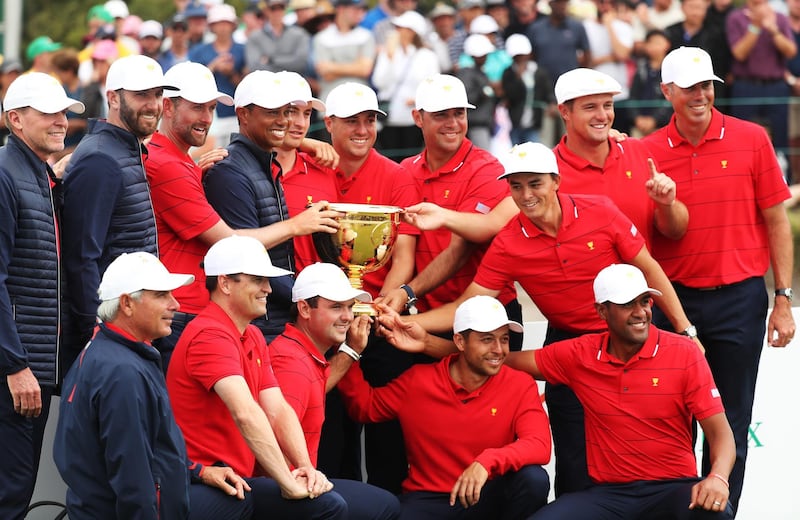 The United States team celebrates with the trophy. Getty
