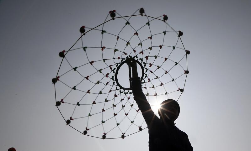 An Indian Sikh devotee performs martial arts during a religious procession ahead of the birth anniversary of the tenth Sikh Guru, Gobind Singh, in Jammu, Kashmir. EPA