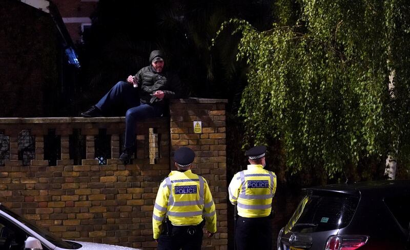 Police presence as Chelsea fans celebrate outside the ground. PA