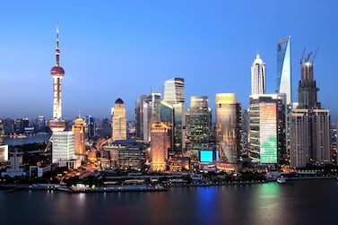 Night view of Huangpu River and the Lujiazui Financial District with the Oriental Pearl TV Tower, Jinmao Tower, the Shanghai World Financial Center and other skyscrapers and high-rise buildings in Pudong, Shanghai, China, 25 July 2012.