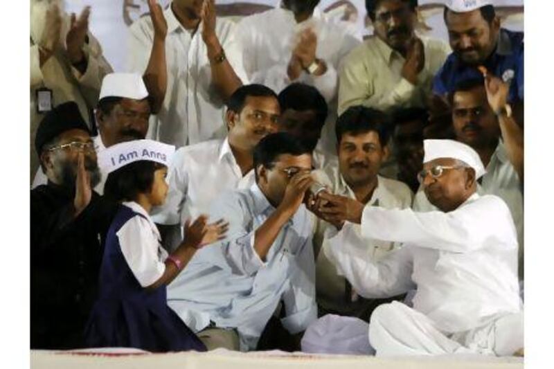 The campaign of Anna Hazare, right, has changed the mindset in India, a reader says. Rafiq Maqbool / AP