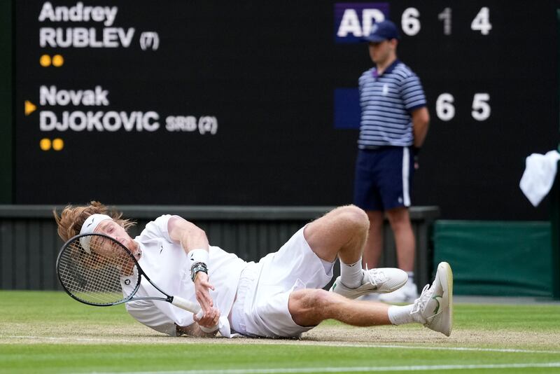Russia's Andrey Rublev tumbles after attempting a return. AP 