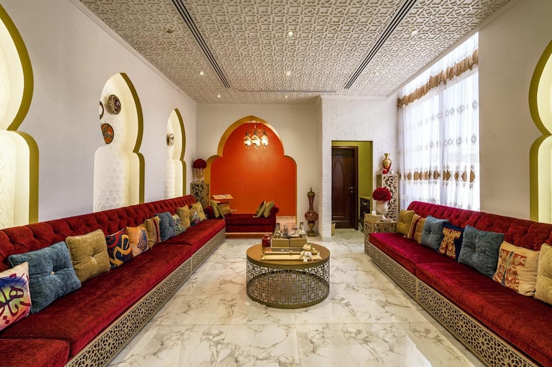 The private majlis features Moorish arches and rich crimson tones. Courtesy LuxuryProperty.com