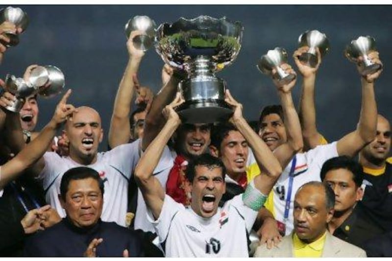 Iraq were the surprise winners of the Asian Cup last time out in July 2007 Younis Khalef, centre, celebrates with teammates.