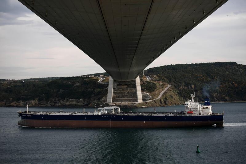 The crude oil tanker Aleksey Kosygin sails out from the city and passes underneath the Yavuz Sultan Bridge, also known as the 3rd Bosporus Bridge, on the Bosporus Strait in Istanbul, Turkey, on Friday, Dec. 1, 2017. The bridge, billed as the world's widest is named after Ottoman Sultan Selim the Grim, known in Turkish as Yavuz Sultan Selim, who ruled in the 16th century, was opened in August 2016 to ease traffic congestion in the city of more than 17 million and links Asia to Europe. Photographer: Kostas Tsironis/Bloomberg