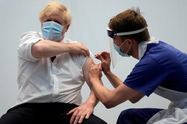 Britain's Prime Minister Boris Johnson receives his second dose of the AstraZeneca Covid-19 vaccine at the Francis Crick Institute in London on June 3, 2021. Matt Dunham / Pool via Reuters