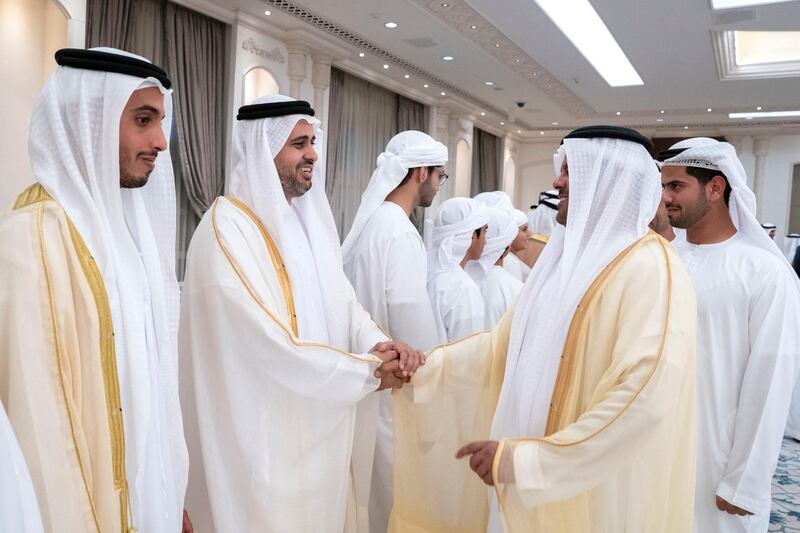 ABU DHABI, UNITED ARAB EMIRATES - June 04, 2019: HH Sheikh Theyab bin Mohamed bin Zayed Al Nahyan, Chairman of the Department of Transport, and Abu Dhabi Executive Council Member (2nd L), greets a guest, during an Eid Al Fitr reception at Mushrif Palace. Seen with other dignitaries.

( Mohamed Al Hammadi / Ministry of Presidential Affairs )
---