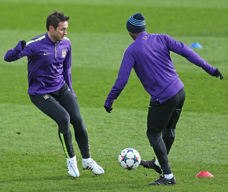 Manchester City's Frank Lampard and Fernandinho shown during the team training session on Monday ahead of a Tuesday match against Barcelona in the Champions League. Carl Recine / Reuters