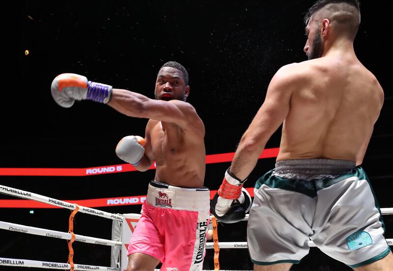 Kelvin Dotel (pink) takes on Rohan Date (grey) in a Super Featherweight bout at the Coca Cola Arena, Dubai. Chris Whiteoak/ The National