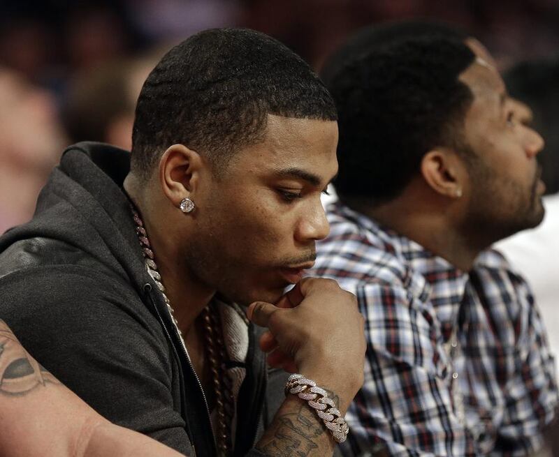 Rapper Nelly sits near the court during the skills competition. Gerald Herbert / AP photo