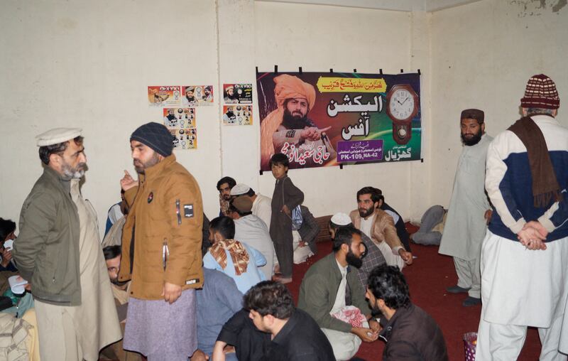 Supporters of Saeed Anwar Mehsud, an independent candidate from South Waziristan, sit inside their campaign office in Dera Ismail Khan. Reuters