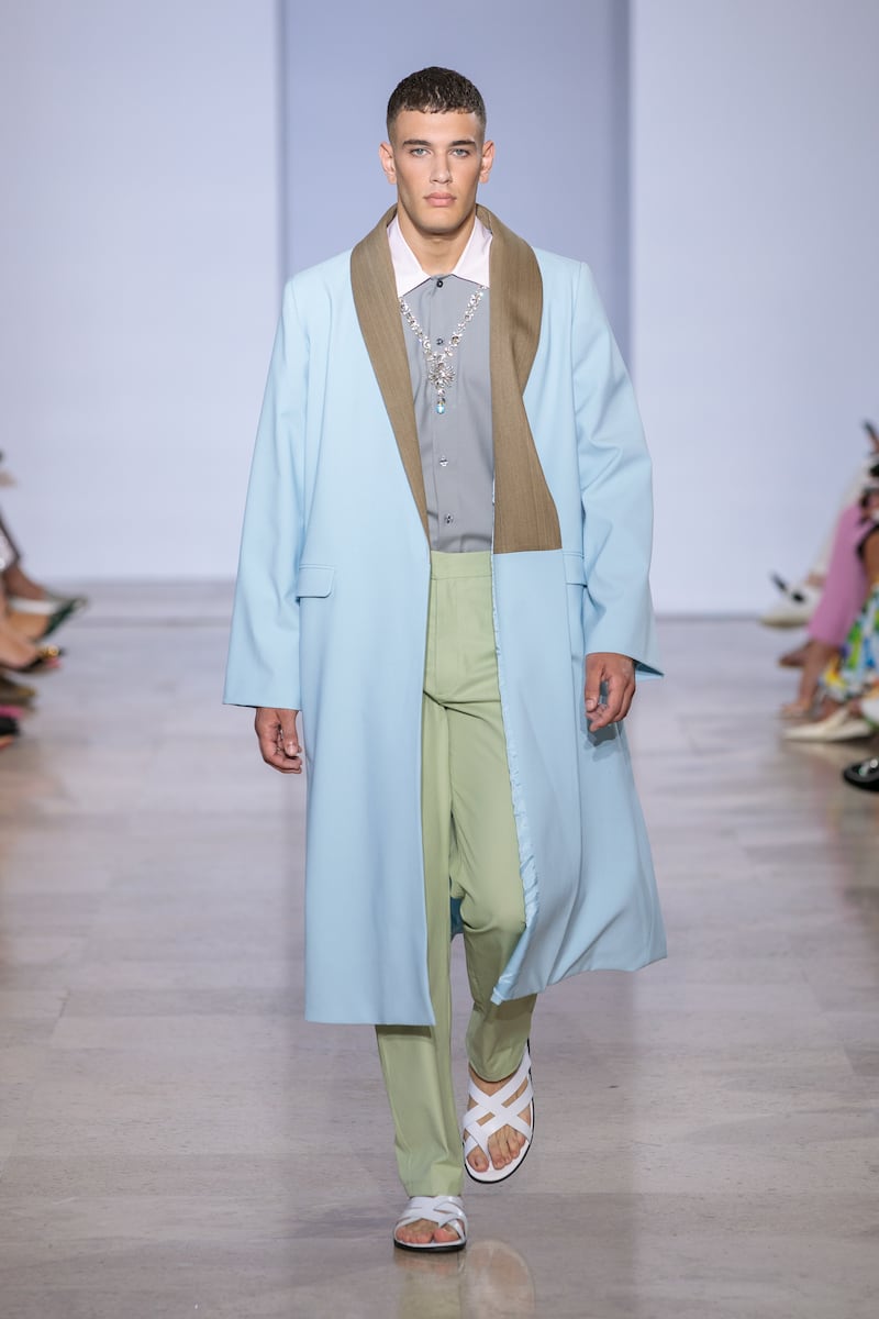 The collection's restrained use of colour is evident in this menswear look.