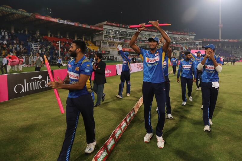epa07909042 Sri Lanka's Cricket Team celebrate after they won the third and the last T20 International Cricket match against Sri Lanka, at Gaddafi Cricket Stadium, in Lahore, Pakistan, 09 October 2019. Sri Lanka is currently touring Pakistan for a three one-day internationals (ODIs) and three Twenty20 Internationals (T20s) series against Pakistan.  EPA/RAHAT DAR