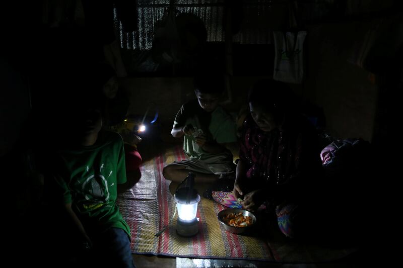 A solar lamp lights up a displaced family's tent, a few days after President Rodrigo Duterte announced the liberation of Marawi city from pro-Islamic State militant groups, at an evacuation site in the municipality of Pantar, Lanao Del Sur, southern Philippines October 20, 2017. REUTERS/Romeo Ranoco