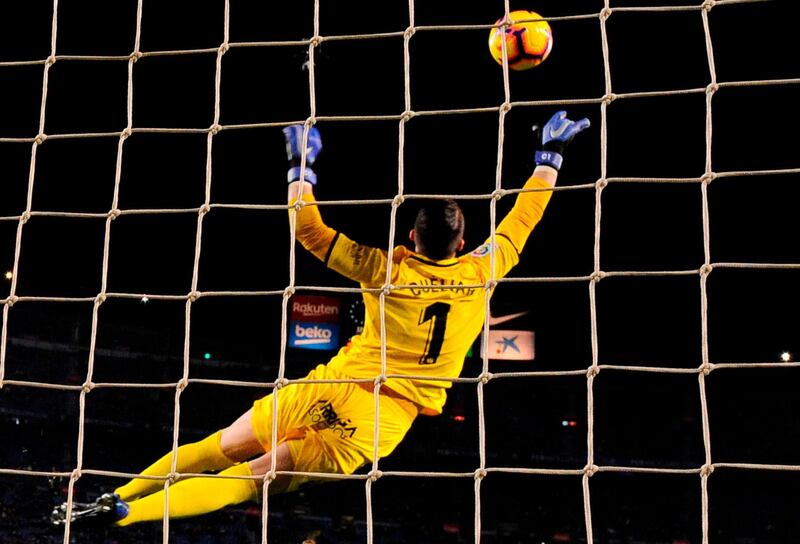 Leganes goalkeeper Pichu Cuellar makes an acrobatic save against Barcelona. AFP