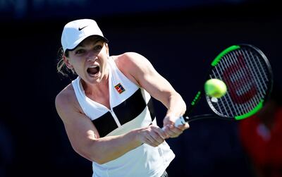 epa07382268 Simona Halep of Romania in action against Lesia Tsurenko of Ukraine during their third round match of the Dubai Duty Free Tennis WTA Championships 2019 in Dubai, United Arab Emirates, 20 February 2019.  EPA/ALI HAIDER