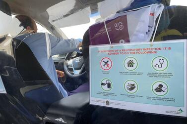 Plastic insulators have been installed inside taxis for the safety of the drivers and passengers. Pawan Singh / The National