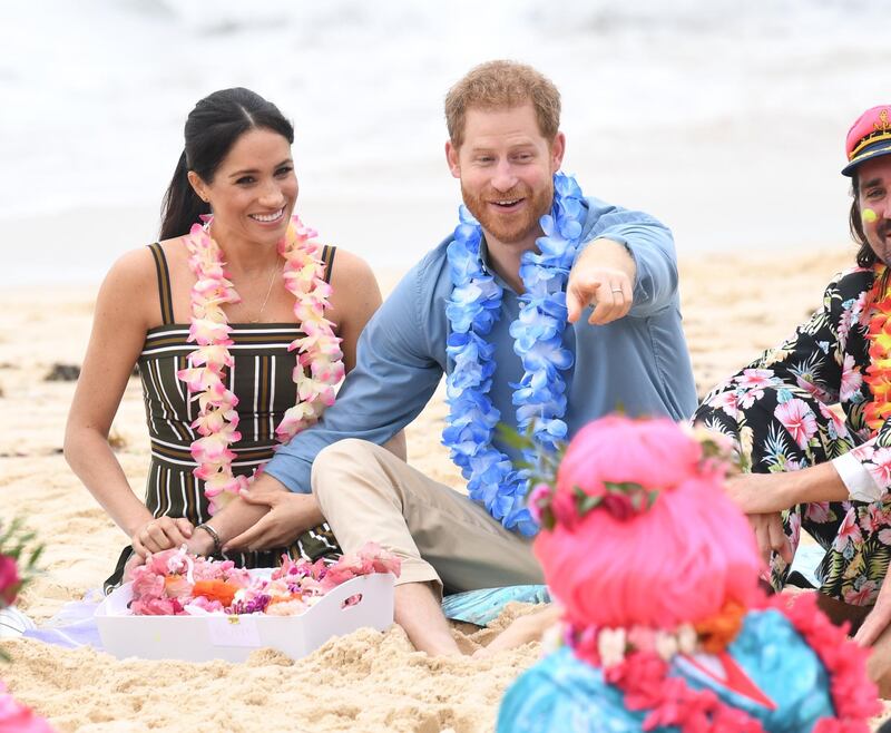 SYDNEY, AUSTRALIA - OCTOBER 19: Prince Harry, Duke of Sussex and Meghan, Duchess of Sussex talk to members of OneWave, an awareness group for mental health and wellbeing at South Bondi Beach on October 19, 2018 in Sydney, Australia. The Duke and Duchess of Sussex are on their official 16-day Autumn tour visiting cities in Australia, Fiji, Tonga and New Zealand.  (Photo by Paul Edwards - Pool/Getty Images)