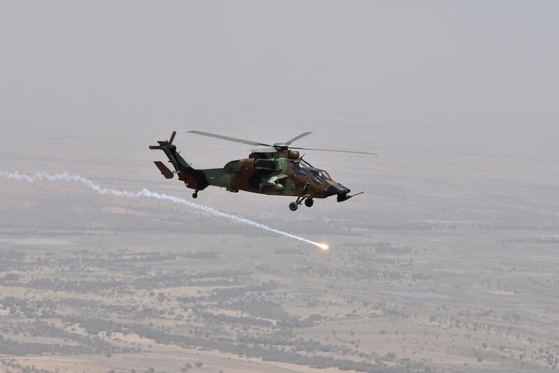 epa08025953 (FILE) - A French military helicopter flies over Gao during a visit by French President Emmanuel Macron (unseen) to France's Barkhane counter-terrorism operation in Africa's Sahel region, northern Mali, 19 May 2017 (reissued 26 November 2019). According to recent reports, 13 French soldiers died in helicopter crash during the Barkhane counter-terrorism operation against jihadists in Mali.  EPA/CHRISTOPHE PETIT TESSON / POOL