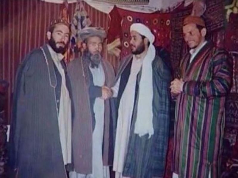 A photograph has emerged showing the father of the Manchester bomber and Islamist Libyan commander meeting the Taliban in the 1990s