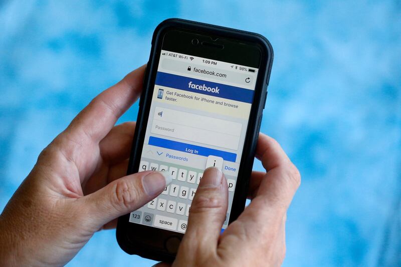 FILE - In this Aug. 21, 2018, file photo, a Facebook start page is shown on a smartphone in Surfside, Fla. Security researchers have uncovered more instances of Facebook user data being publicly exposed on the internet, further underscoring its struggles as it deals with a slew of privacy and other problems. (AP Photo/Wilfredo Lee, File)