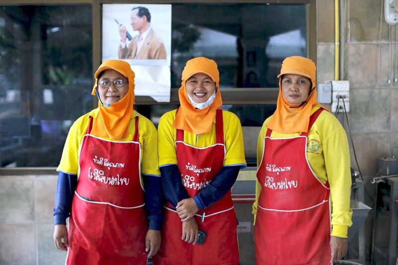 Above, workers at a rice mill in Khon Kaen. Thailand may tap into state inventories next year to maintain export levels to offset a possible decline in production due to dry weather. Jorge Silva / Reuters