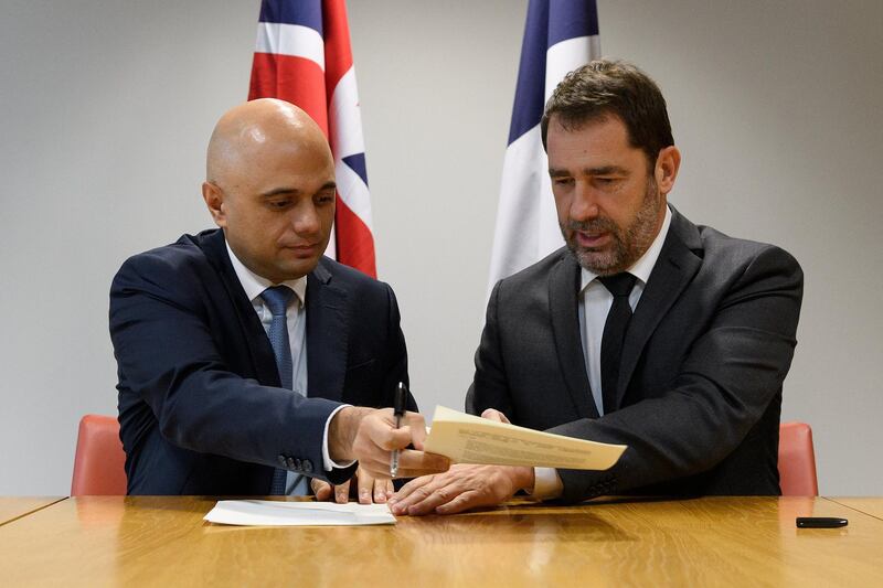 Britain's Home Secretary Sajid Javid and French Interior Minister Christophe Castaner take part in a signing ceremony for a new action plan to strengthen efforts against migrant activity in the English Channel, in London, Britain, January 24, 2019. Leon Neal/Pool via REUTERS