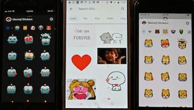 This photo illustration shows a selection of emojis and stickers displayed on smart phones in Washington, DC on December 19, 2019.  Researchers from the University of North Carolina at Chapel Hill and the Max Planck Institute for the Science of Human History have used a new tool in comparative linguistics to examine emotional concepts across the world, finding the way we think of things like anger, fear, and joy depends on our language. Their study drew on data from nearly 2,500 languages, including large ones with millions of speakers to small ones with thousands, and was published in the journal Science on December 19, 2019.  / AFP / EVA HAMBACH
