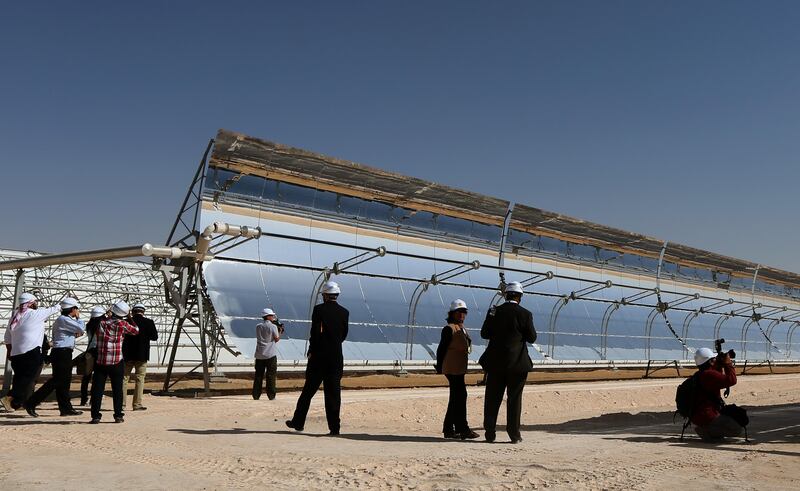 TO GO WITH STORY BY ALI KHALIL
Journalists visit the Shams 1, Concentrated Solar power (CSP) plant, in al-Gharibiyah district on the outskirts of Abu Dhabi, on March 17, 2013 during the inauguration of the facility. Oil-rich Abu Dhabi officially opened the world's largest Concentrated Solar Power (CSP) plant, which cost $600 million to build and will provide electricity to 20,000 homes. AFP PHOTO/MARWAN NAAMANI / AFP PHOTO / MARWAN NAAMANI