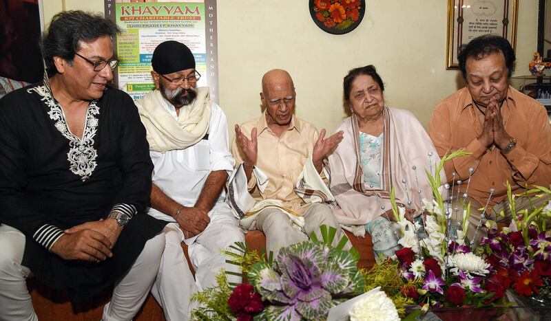 Talat Aziz (left), Uttam Singh (second left), Bhupinder Singh (right) and singer Jagjit Kaur (second right) celebrate the 92nd birthday of Khayyam (centre) on February 18, 2019.  AFP
