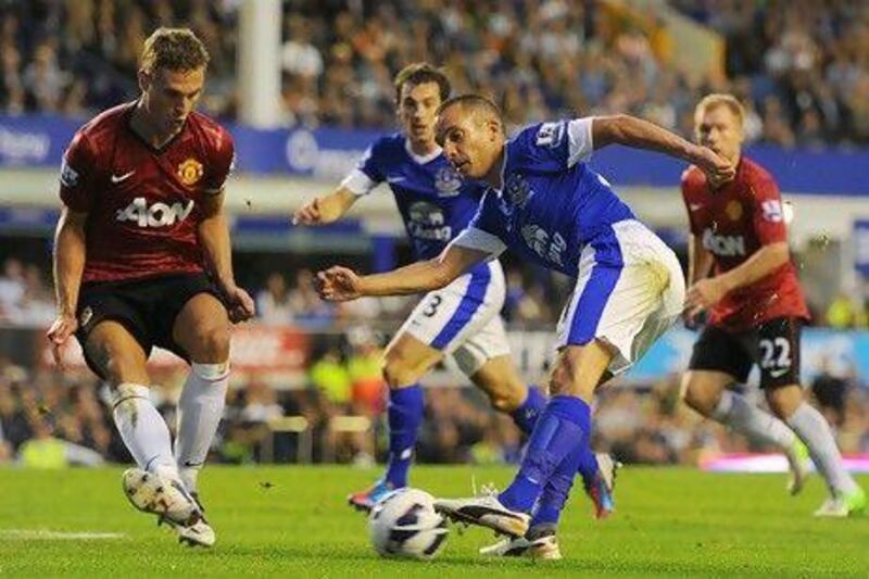 Leon Osman of Everton shoots at goal during the Premier League match between Everton and Manchester United at Goodison Park. Michael Regan / Getty Images