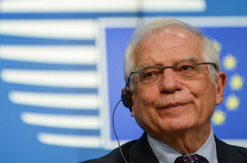 FILE - In this Monday, Feb. 22, 2021 file photo, European Union foreign policy chief Josep Borrell speaks to the media as he arrives for a meeting of EU foreign ministers at the European Council building in Brussels. The top European Union diplomat supervising the international agreement aimed at curbing Iran's nuclear ambitions called Friday, Feb. 26, 2021 for a concerted effort to reinvigorate the pact. (Yves Herman, Pool via AP, File)