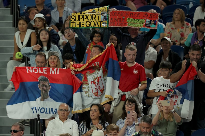 Novak Djokovic fans show their support by displaying Serbia flags inside Rod Laver Arena. Getty Images