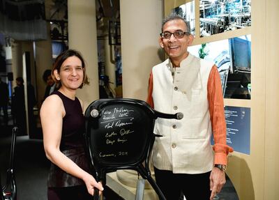 epa08048380 Nobel laureates in economics, Indian Abhijit Banerjee (R) and French Esther Duflo (L) sign their chairs at the Nobel Museum in Stockholm, Sweden, 06 December 2019. The Nobel Prize award ceremony will take place in Stockholm on 10 December.  EPA/HENRIK MONTGOMERY  SWEDEN OUT