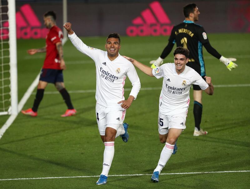 Real Madrid's Casemiro celebrates with Miguel Ortega Gutierrez after scoring their second goal. Reuters