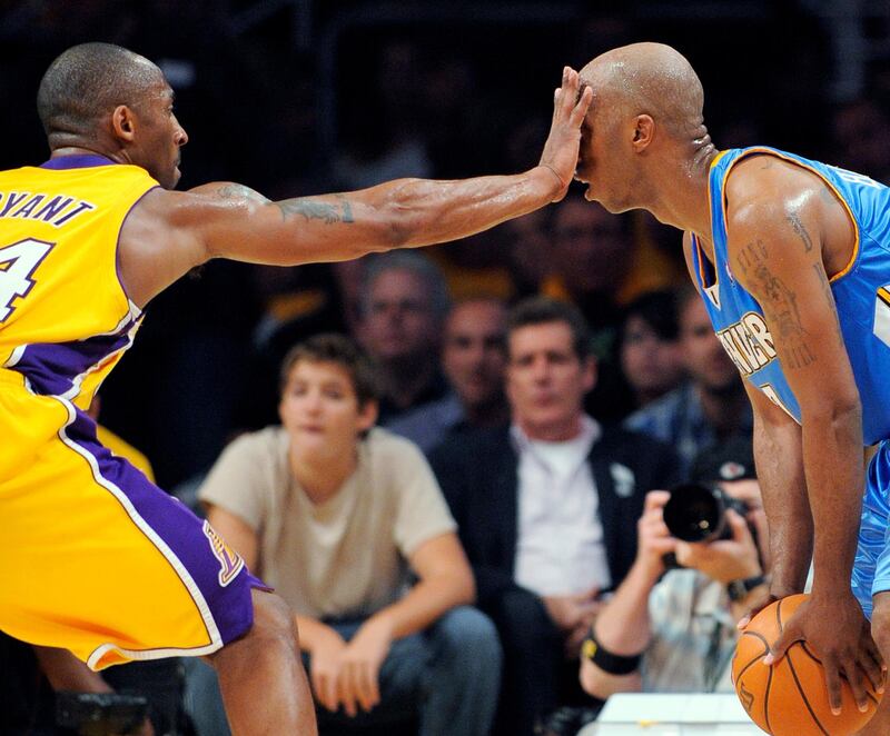 Los Angeles Lakers guard Kobe Bryant defends Denver Nuggets guard Chauncey Billups during the second half of Game 1 of the NBA basketball Western Conference finals, in Los Angeles. AP Photo/Mark J. Terrill, File