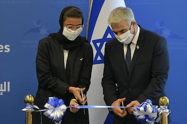 A handout picture released by the Israeli Government Press Office (GPO) shows Emirati Minister of Culture and Knowledge Development Noura al-Kaabi (L) and Israeli alternate prime minister and Foreign Minister Yair Lapid during the inauguration of the Israeli Embassy in Abu Dhabi, on June 29, 2021. - - Israel OUT / RESTRICTED TO EDITORIAL USE - MANDATORY CREDIT "AFP PHOTO / GPO" - NO MARKETING NO ADVERTISING CAMPAIGNS - DISTRIBUTED AS A SERVICE TO CLIENTS / AFP / GPO / Shlomi AMSALEM / RESTRICTED TO EDITORIAL USE - MANDATORY CREDIT "AFP PHOTO / GPO" - NO MARKETING NO ADVERTISING CAMPAIGNS - DISTRIBUTED AS A SERVICE TO CLIENTS