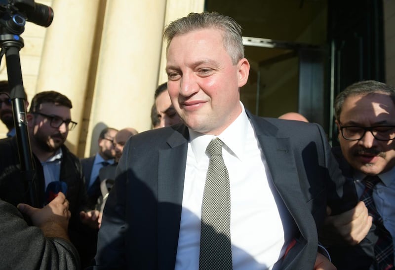 Malta's outgoing Tourism minister Konrad Mizzi walks outside after leaving the office of the Prime Minister in Valletta, Malta, announcing his resignation from his post following a parliamentary meeting on November 26, 2019. Malta's tourism minister said on November 26 he was stepping down, hours after the prime minister's chief of staff quit, in the latest political fallout from a widening probe into a reporter's 2017 killing. 

 / AFP / Matthew Mirabelli

