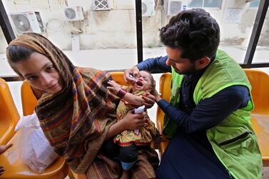 A Pakistani health worker administers polio drops to a child during a polio vaccination campaign at Lady Reading government hospital in Peshawar, Pakistan, 02 October 2023.  Four environmental samples collected in August from Karachi and Peshawar have tested positive for the poliovirus.  Pakistan's National Polio Laboratory has confirmed the detection of Type-1 Wild Poliovirus (WPV1) in these samples, indicating a risk of transmission in these areas.  Polio is a highly infectious and incurable disease that primarily affects children under the age of five.  Repeated vaccination is the most effective way to protect children from polio, and Pakistan and Afghanistan are the only two remaining endemic countries in the world.   EPA / ARSHAD ARBAB