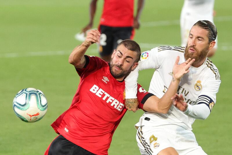 Mallorca's Daniel Rodriguez in action against Sergio Ramos. EPA