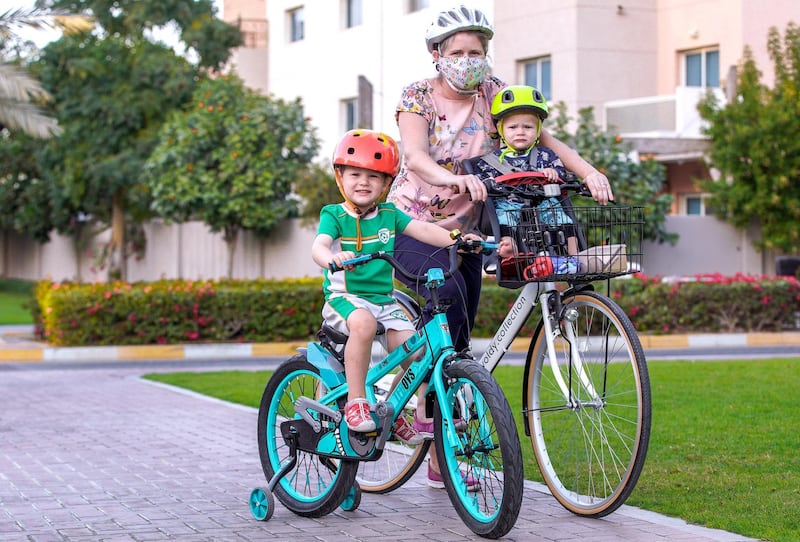 Abu Dhabi, United Arab Emirates, January 19, 2021.  Al Reef Village in Abu Dhabi. Deirdi Harrington takes her sons, Cian, 4 and Carmac, 1 for an afternoon bike ride.
Victor Besa/The National 
Section:  NA
Reporter:  Gillian Duncan