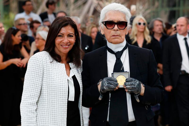 Paris's mayor Anne Hidalgo awards the Grand Vermeil De La Ville De Paris medal to German fashion designer Karl Lagerfeld after Chanel's haute couture autumn/winter 2017-18 show in Paris on July 4. Patrick Kovarik / AFP