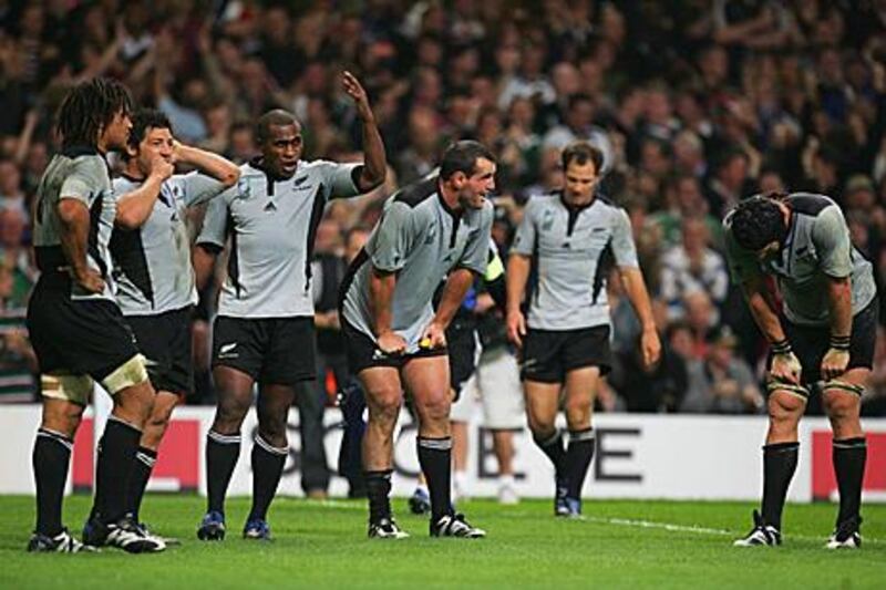 New Zealand players look dejected after losing to France in the quarter-finals of the 2007 World Cup.