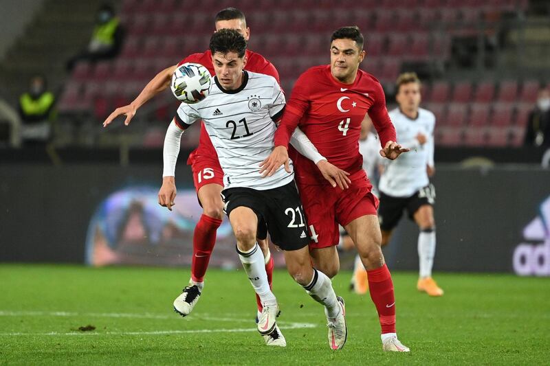 Germany's midfielder Kai Havertz battles for the ball with Turkey defender Ozan Kabak. AFP